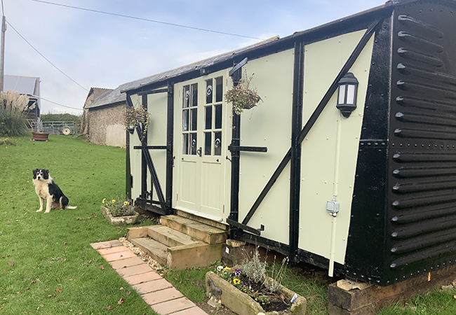 Stay in the charming railway carriage at Higher Biddacott Farm.